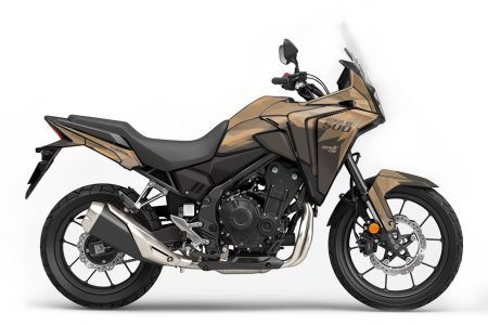 Honda NX500 adventure motorcycle with sand color ''passion'' graphics kit featuring angular shapes and bold, agressive design.
