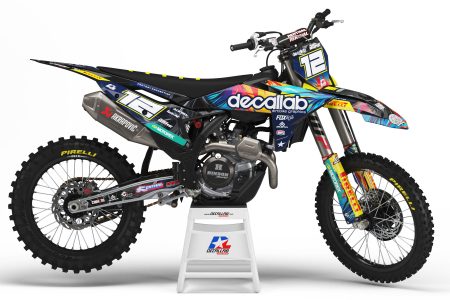 Spectrum motocross graphics kit with colorful blue, pink, yellow and black design on an off-road motorcycle