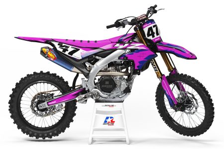 Sketchy custom MX graphics kit in pink, white and blue shown on a dirt bike