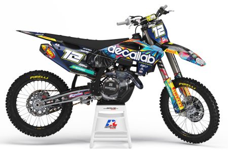 Colorful Spectrum Husqvarna graphics kit on a dirt bike